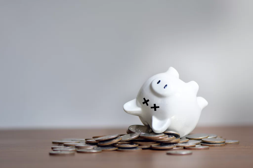 Blog 2 white piggy bank with coins